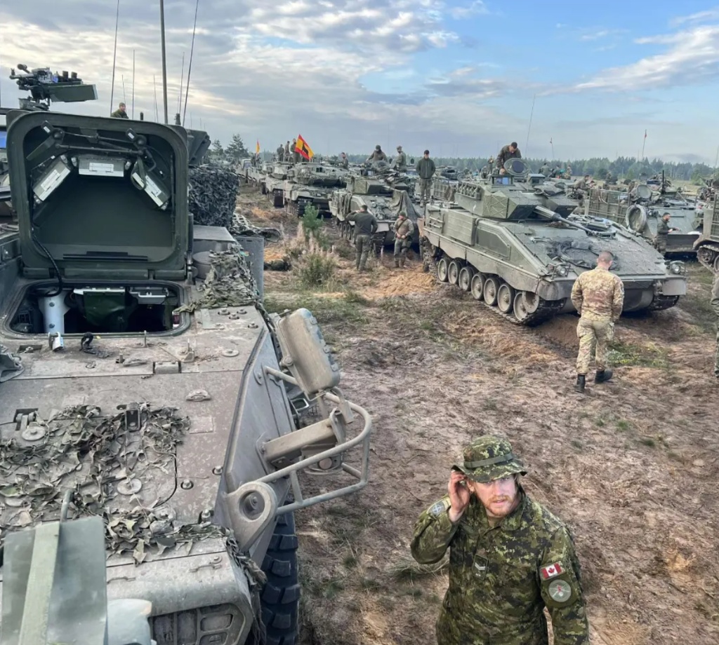 Serving in physical security next to tanks